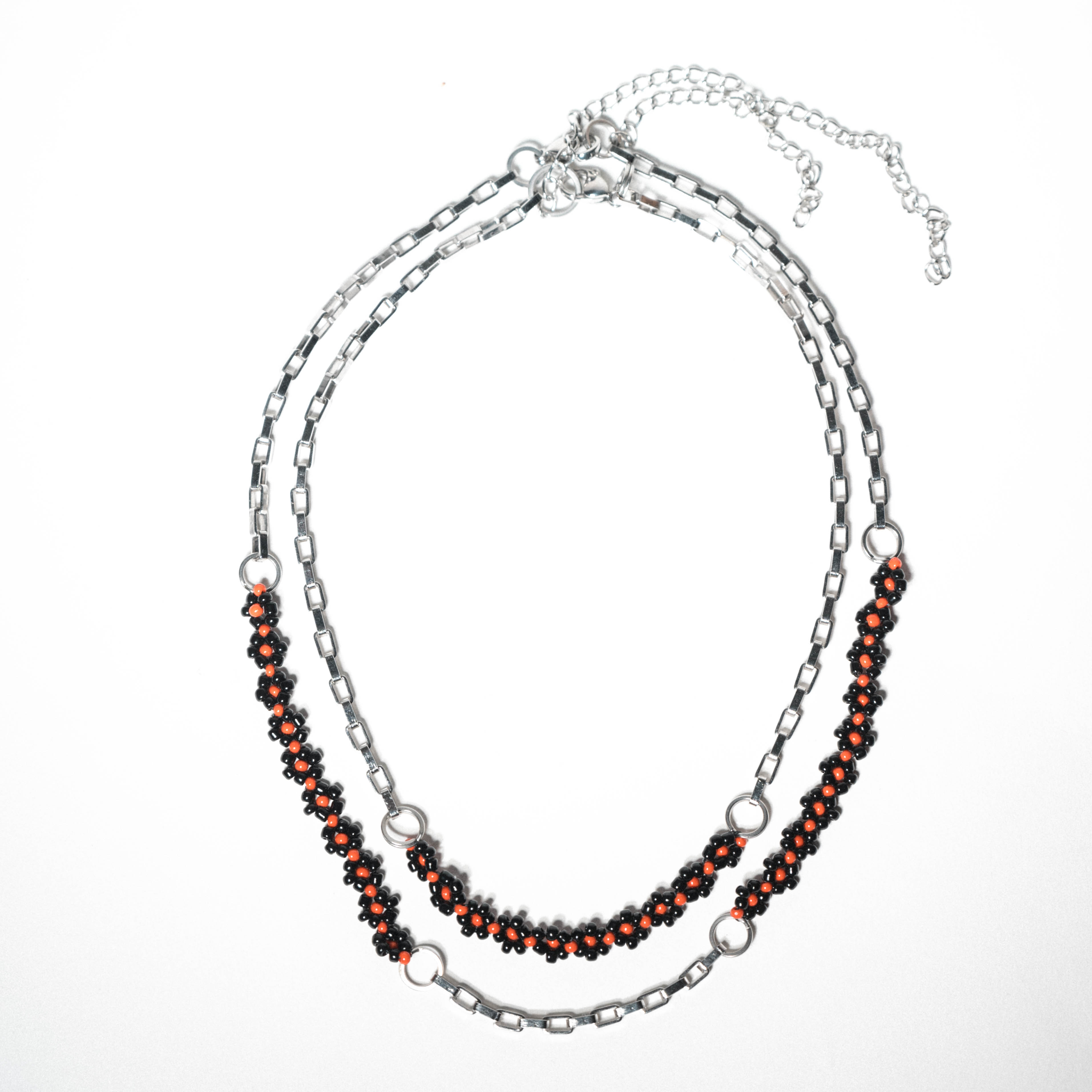 Layered silver-tone chain necklace with black and red beadwork
